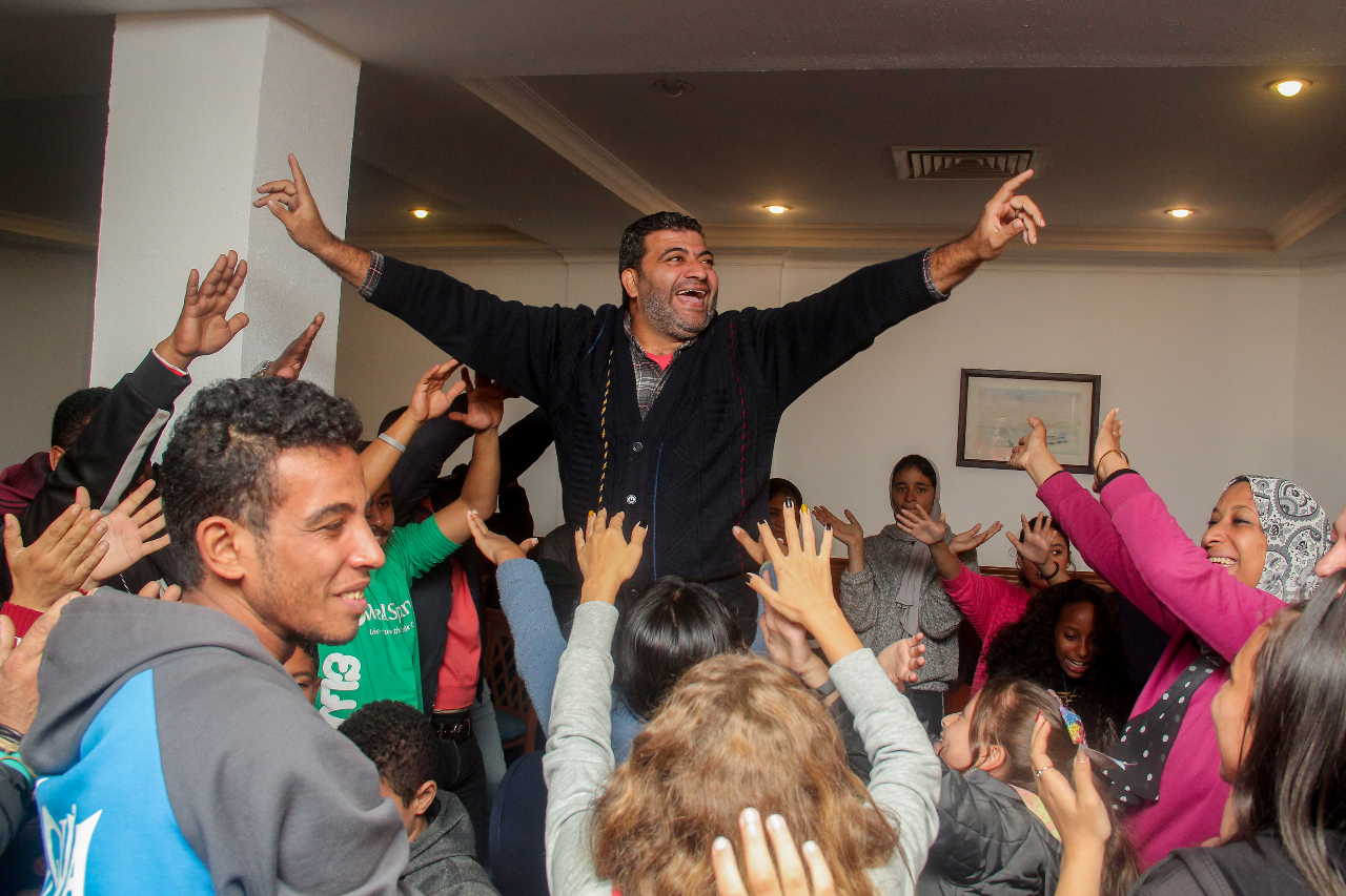 Amr Mossad celebrating with his team after winning in one of the activities organized at the family camp that took place in Alexandria from 9 to 11 December 2021.   Photo: Courtesy of WellSpring Egypt