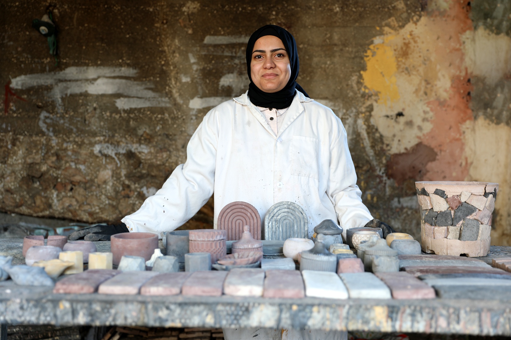 Rawan and the products she produced out of used glass and turned into eco-friendly decorative stones, sold in the market for approximately $15 per square meter.