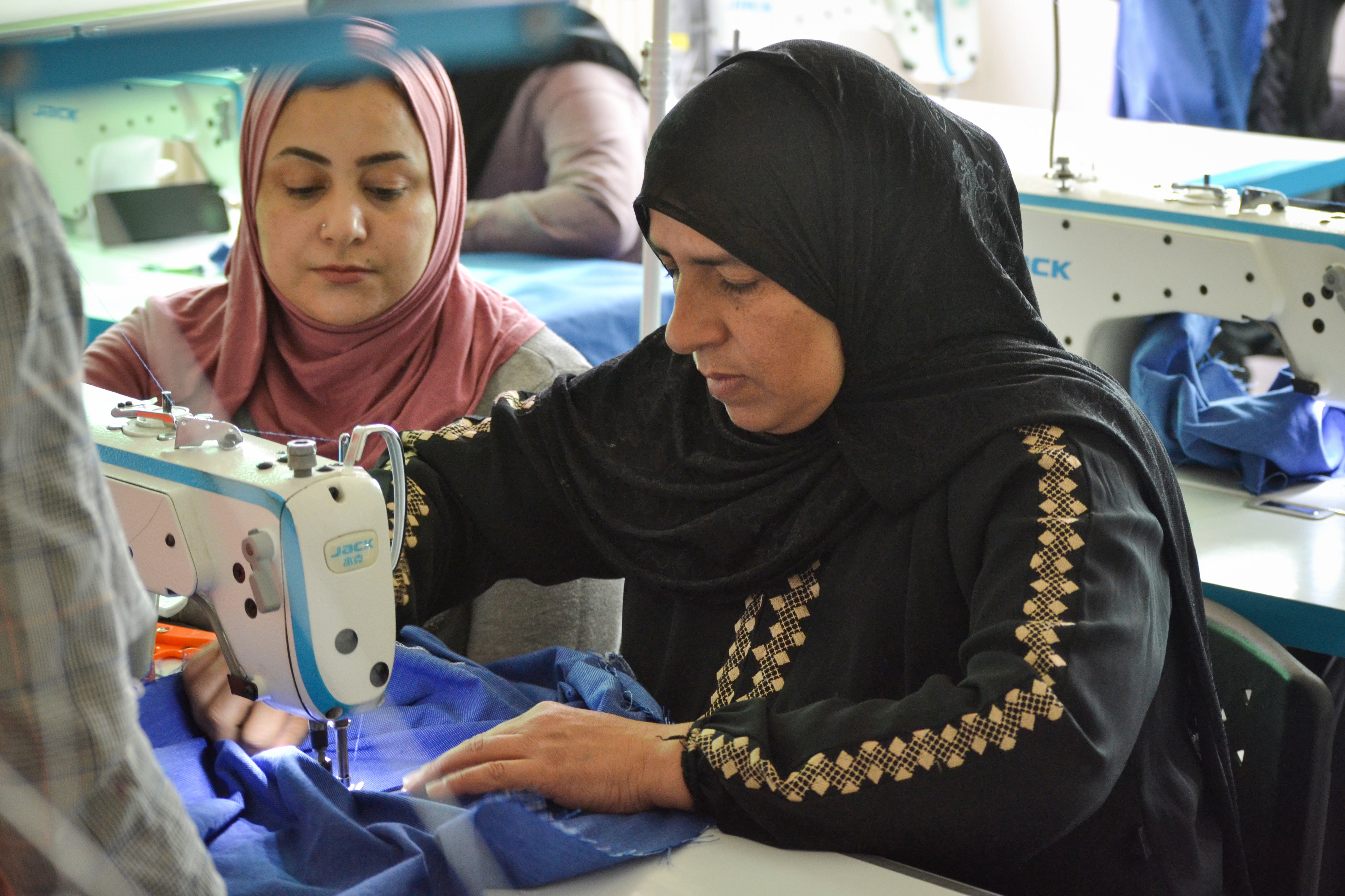 Taghreed during a class, giving tips for one of her students. Photo: UN Women/Bashar Al-Jabari