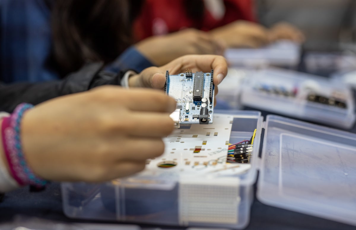 A young woman in one of the science and technology trainings funded by UN Women.