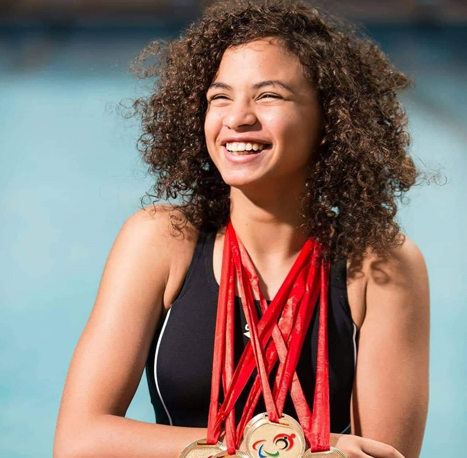 Malak Abdelshafi, Egyptian Champion in Paralympic Swimming, donning some of her medals. Photo: Courtesy of Malak Abdelshafi