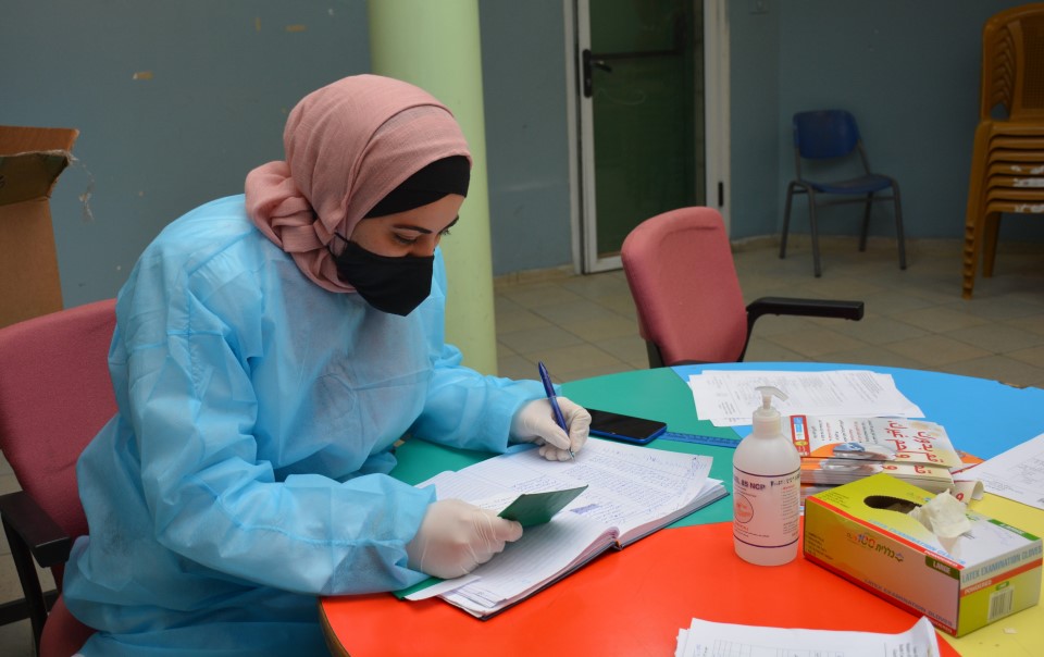Leila Saleh* receives training at a COVID-19 vaccination centre in Nablus, the West Bank. Photo: Juzoor