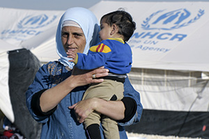 A woman and child at the Za’atri refugee camp, which hosts an estimated 100,000 Syrians displaced by conflict, near Mafraq, Jordan.