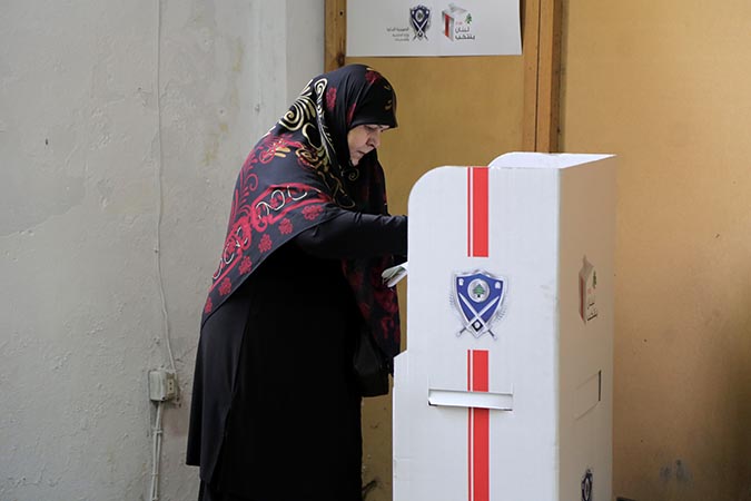  A woman casts her vote in Lebanon's parliamentary elections. Photo: UN Women/Jean Safi