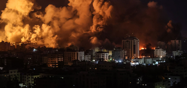 Flames and smoke billow during Israeli strikes in Gaza on 9 October 2023.